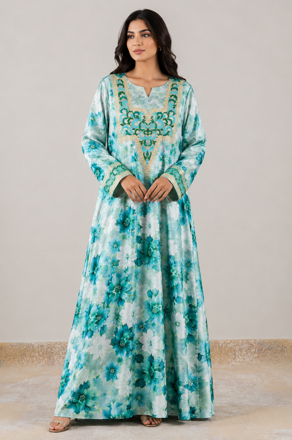 Turquoise floral Harir Mukhawar with intricate gold and teal embroidered neckline and cuffs